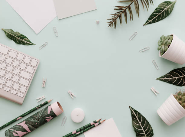 istock Modern Pastel Hipster Frame With keyboard, botanical elements, supplies, Top View 914687230