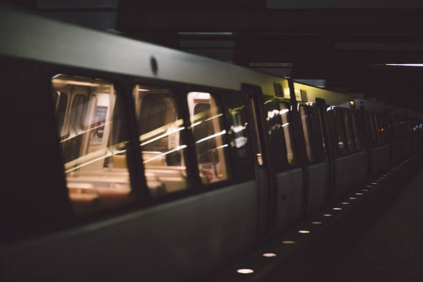 istock Train At Railroad Station Platform At Night 914690278