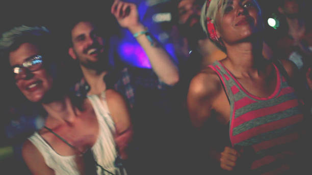 istock Four people dancing in front of stage 914691388