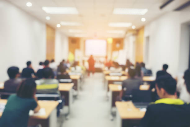 istock Rear View Of People In Classroom 914700116