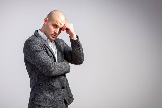istock A young bald man  in suit 914706560