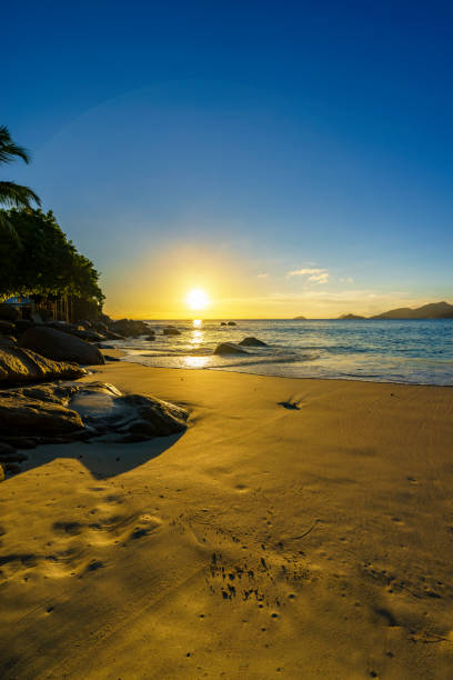 istock beautiful romantic sunset, seychelles beach, golden sand, blue water 1 914706910