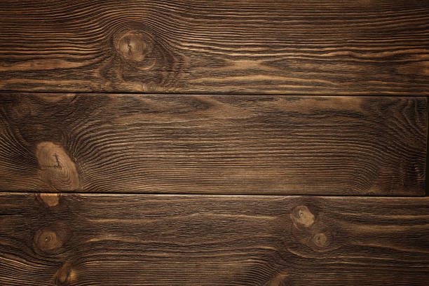 istock Wooden plank, dark brown board, vintage background 914707664