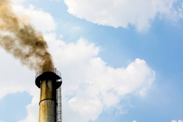 Environmental and contamination : Smoke out of the chimney stock photo