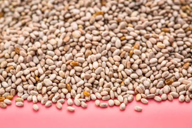 background of organic white chia seeds rich in omega-3 fatty acids