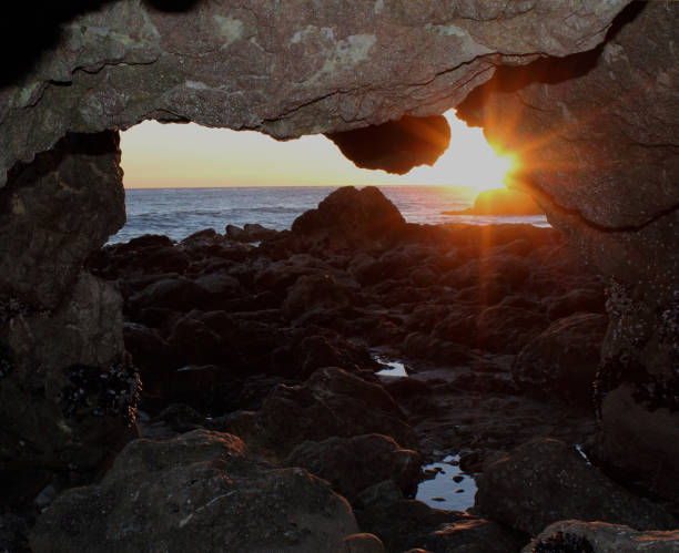 istock beach cave arch at sunset el matador beach, california 914730426