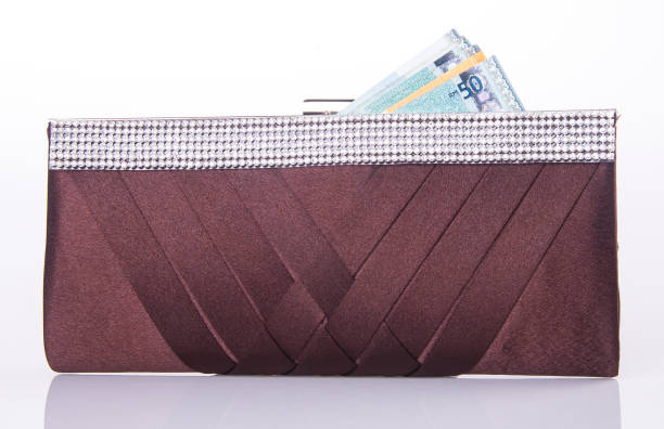 istock woman wallet with money on background 914733328