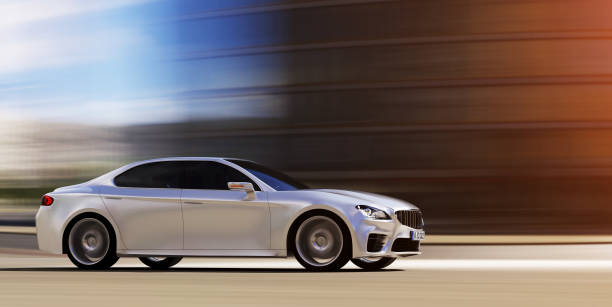 istock car driving on urban road 914734666