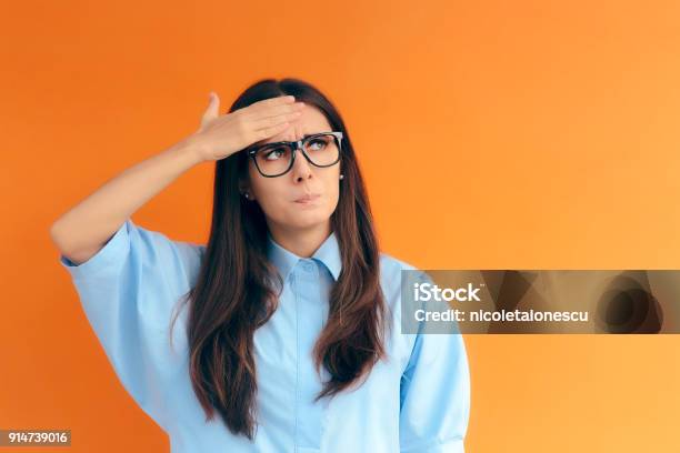 Forgetful Brainy Girl Trying To Remember Her Clever Idea Stock Photo - Download Image Now