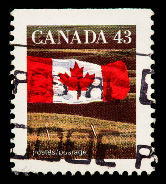 istock Canadian flag and wheat fields postage stamp 914739640