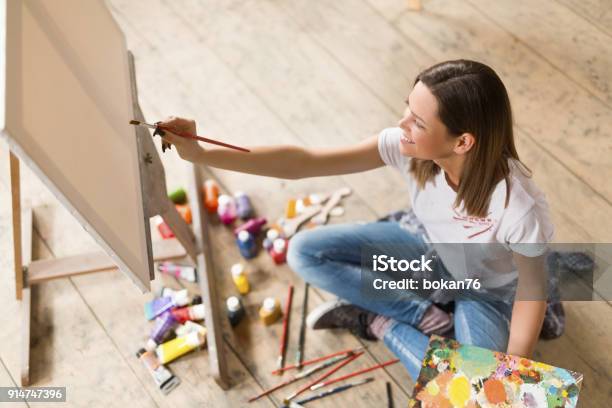 Young Woman Painting On Canvas Stock Photo - Download Image Now - Hobbies, One Woman Only, Women