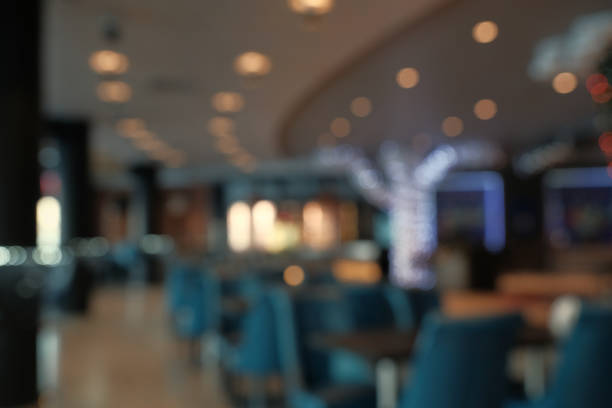 istock Abstract blur restaurant interior for background. Blur coffee shop or cafe restaurant with abstract bokeh light image background 914750300
