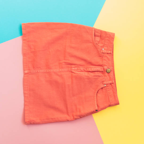 istock orange denim skirt on pink, yellow and blue 914751302