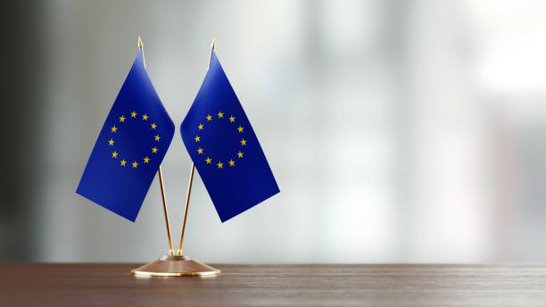 istock European Union Flag Pair On A Desk Over Defocused Background 914751866