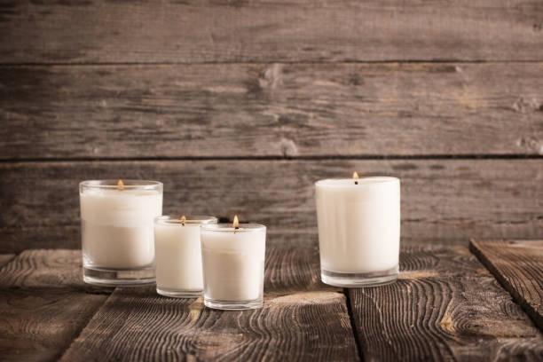 istock candles on old wooden background 914754852