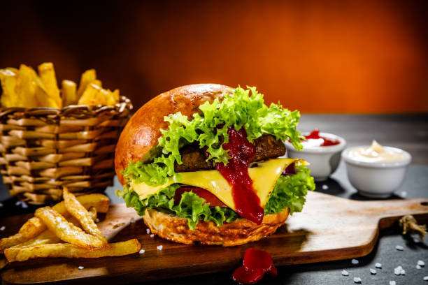 istock Big burger, French fries and vegetables 914754920