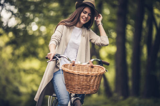 istock Young happy woman cycling in nature during spring day. 914763002