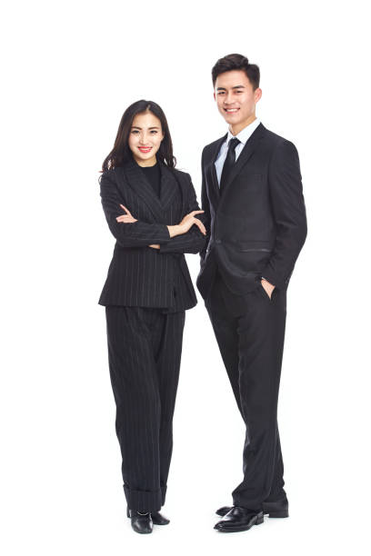 студийный портрет двух молодых азиатских руководителей корпораций - asian ethnicity suit business men стоковые фото и изображения