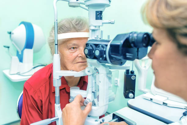 istock Senior woman visiting optician. 914764818