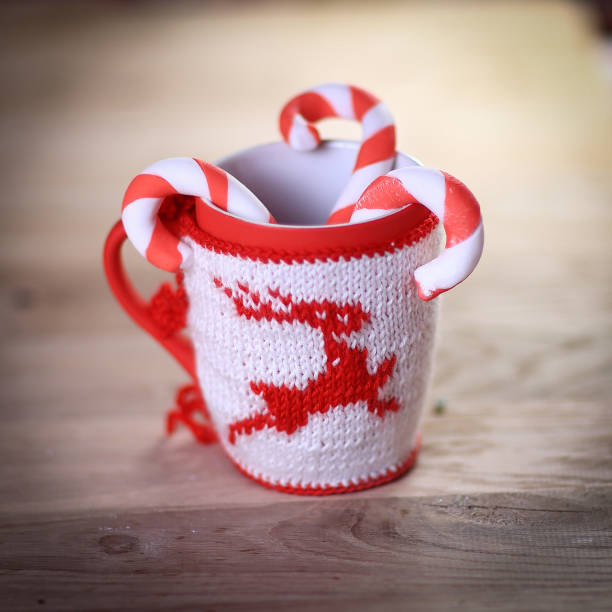 istock Christmas mug and candle on wooden background 914767630