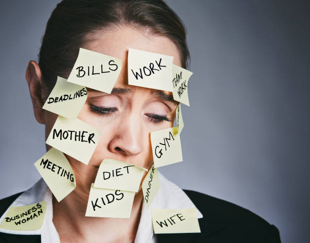 istock Sad woman covered in adhesive notes detailing her many responsibilities 914768310