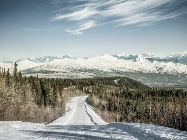 istock snow-covered mountain road at Yukon,Canada 914771010
