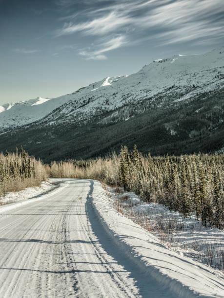 istock snow-covered mountain road at Yukon,Canada 914771070