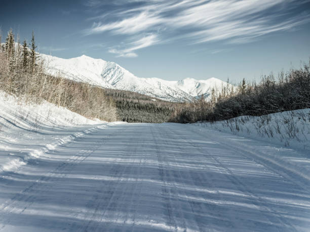 istock snow-covered mountain road at Yukon,Canada 914771168