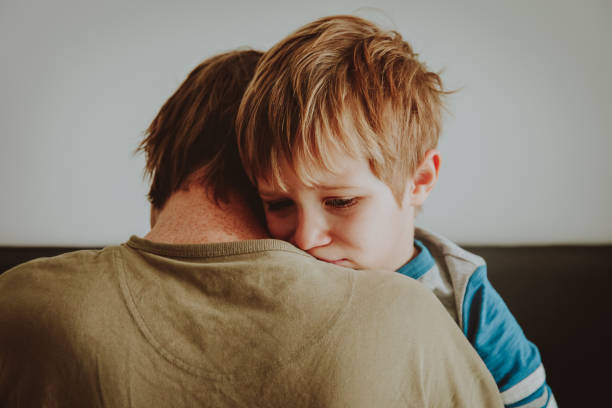 istock father comforting stressed sad son 914772160