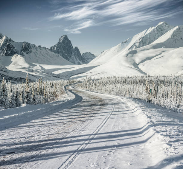 istock snow-covered mountain road at Yukon,Canada 914772454