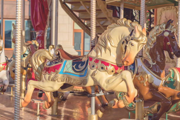 istock Horses on a carnival Merry-Go-Round. toned 914775386