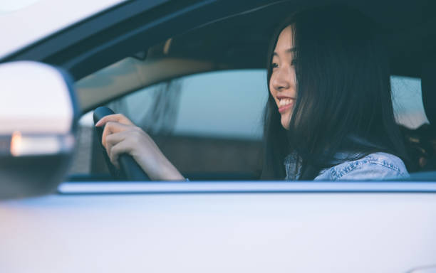 istock Young asian woman driver driving a car 914776840