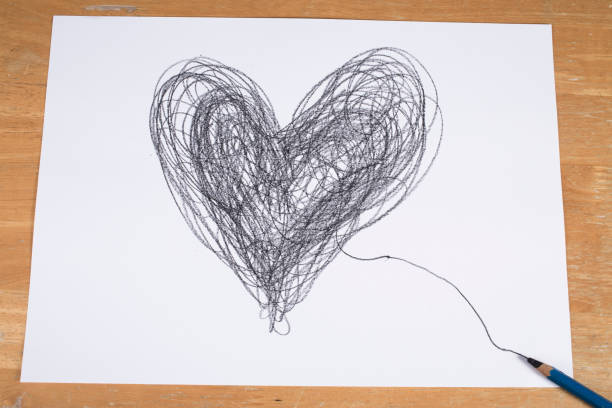 istock Heart drawn by pencil on paper sheet, Valentine's day concept 914777112