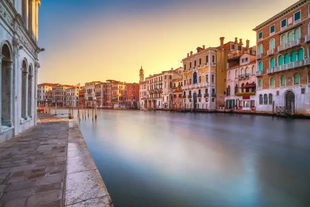 Photo of Venice grand canal at sunrise. Long exposure. Italy