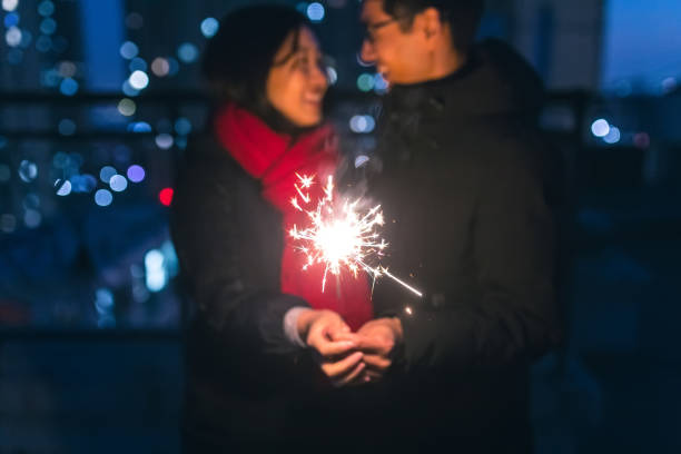 istock Couple holding sparklers at night 914780056