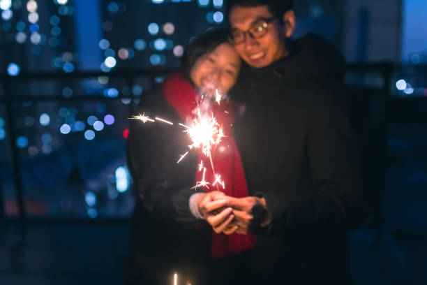 istock Couple holding sparklers at night 914780058