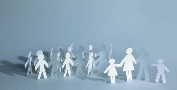 istock many paper men on the paper background 914780570