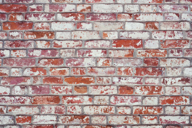 istock Brick wall, old texture of red stone blocks. Background. 914783262