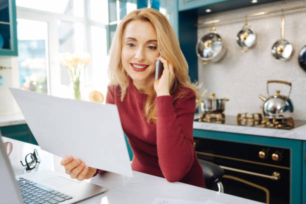 istock Cheerful freelancer talking on the phone 914788556