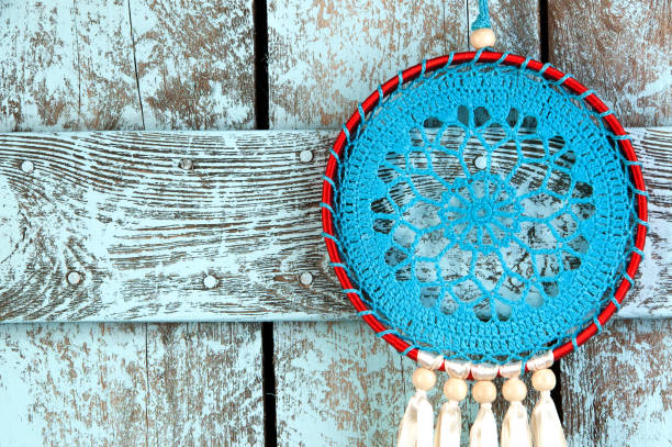 Dream catcher on shabby wooden background