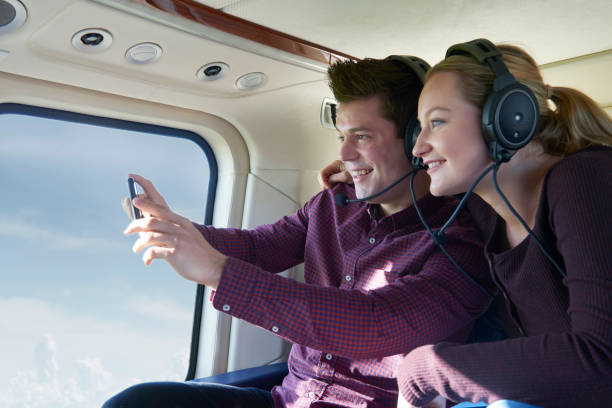 istock Couple On Vacation Taking Ride In Helicopter 914793562