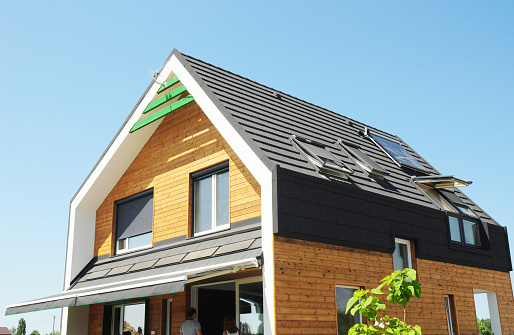 KIEV - UKRAINE, September - 09, 2014: Modern Passive House Construction. Solar water heating (SWH) systems use roof solar panels.