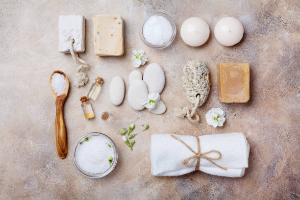istock Spa setting for body care and relaxation on stone background top view. Flat lay. 914796022