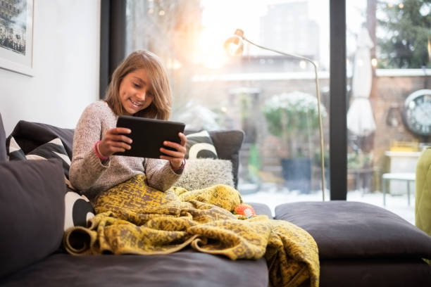 istock Young girl with digital tablet 914796168