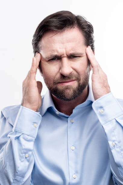 istock Bearded middle-aged man suffering from migraine 914797048