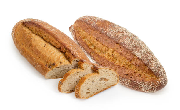 istock Whole and partly sliced brown bread with sprouted wheat grains 914799936