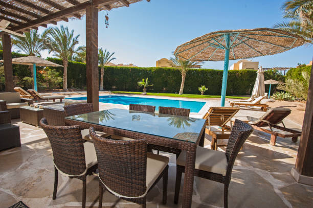 istock Swimming pool at a luxury tropical holiday villa 914801474