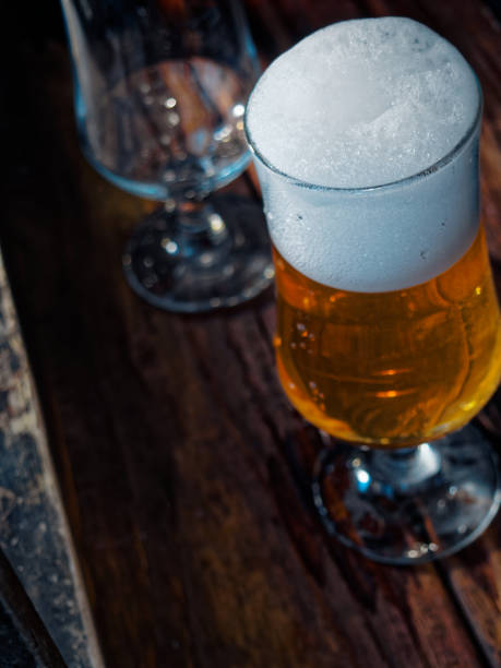 istock Beer on wooden bar counter 914802036