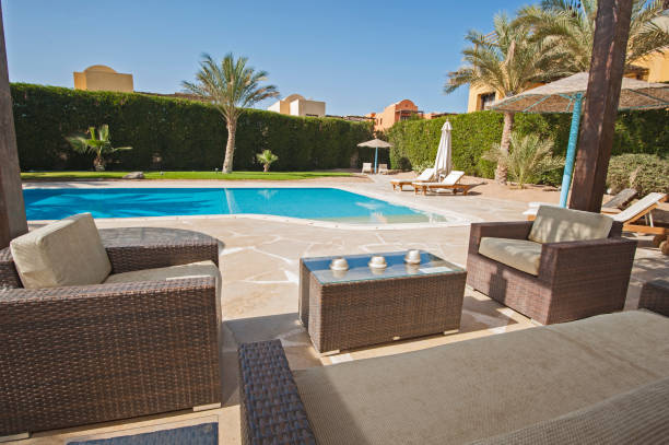 istock Swimming pool at a luxury tropical holiday villa 914802092