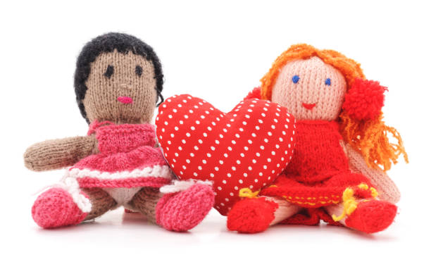 istock Knitted dolls and toy heart. 914802900